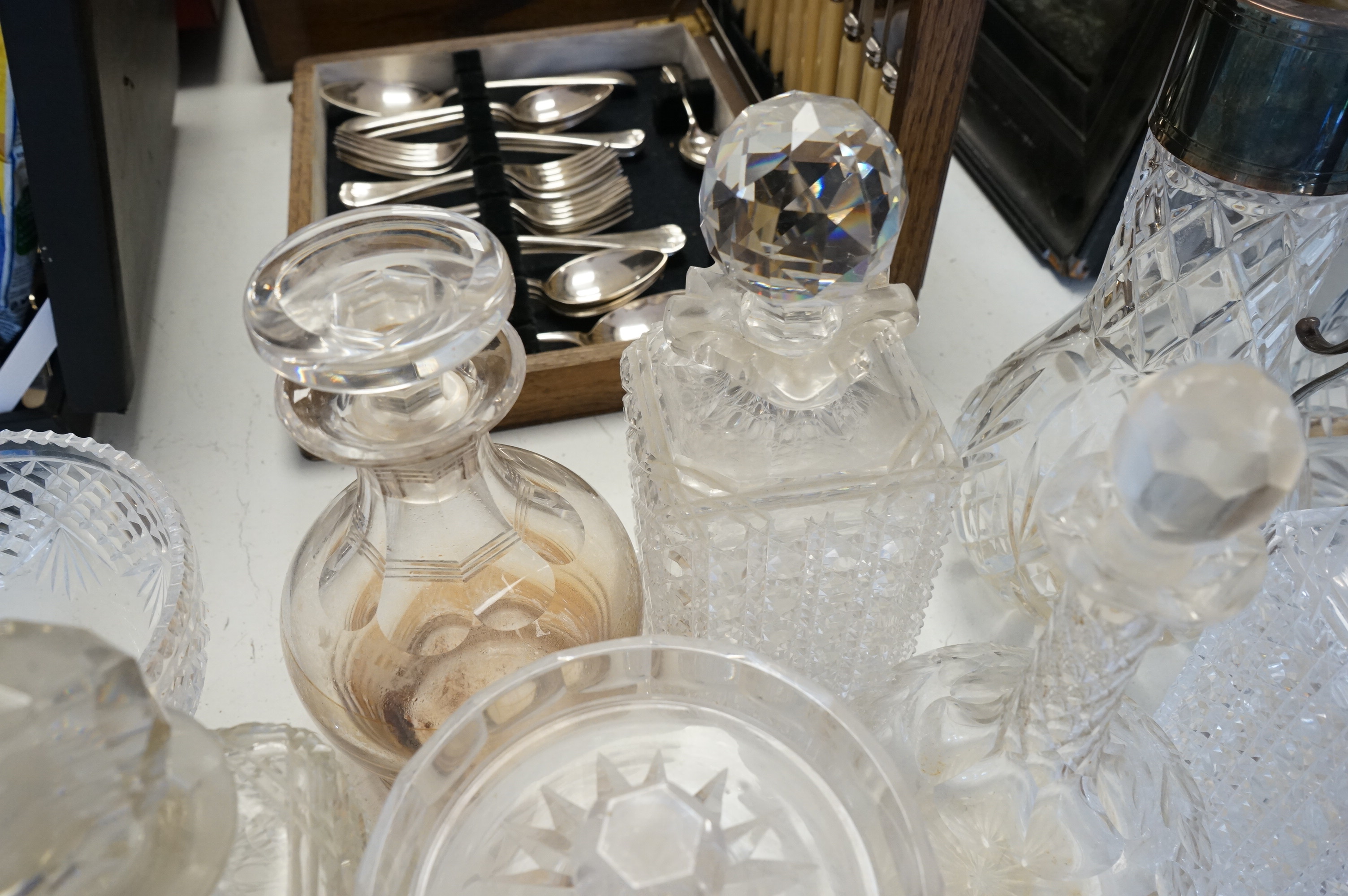 A collection of various cut glass to include decanters and a small pedestal bowl, largest 30cm high